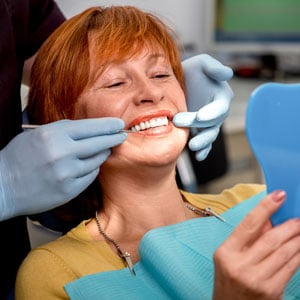 Dentures fitting to a woman